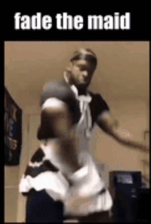 A Man Is Dressed As A Maid And Dancing . GIF