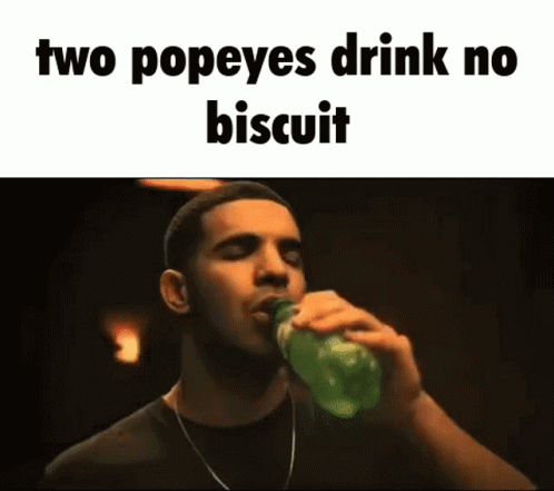 A Man Is Drinking A Bottle Of Popeye 'S Drink . GIF