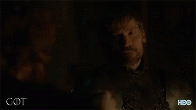 A Man Is Drinking From A Cup With The Word Got On The Bottom GIF