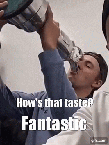 A Man Is Drinking From A Trophy With A Caption That Says How 'S That Taste Fantastic GIF