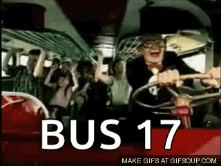 A Man Is Driving A Bus With A Crowd Of People On It And The Words Bus 17 On The Bottom . GIF