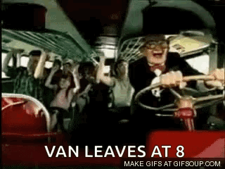 A Man Is Driving A Bus With A Crowd Of People On The Back . GIF