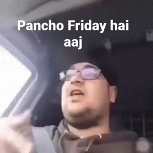 A Man Is Driving A Car And Making A Funny Face . GIF