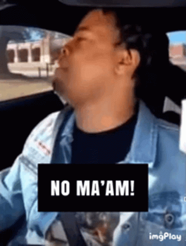 A Man Is Driving A Car With A Sign That Says No Ma 'Am ! GIF