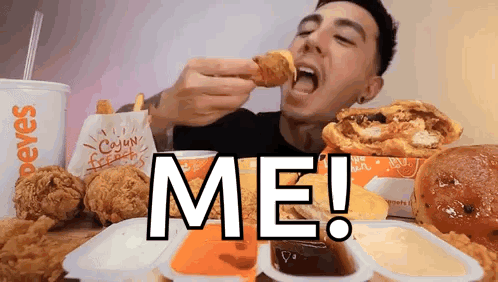 A Man Is Eating A Chicken Nugget From A Popeye 'S Menu GIF