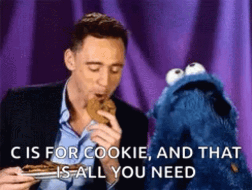 A Man Is Eating A Cookie Next To A Cookie Monster That Says `` C Is For Cookie And That Is All You Need '' . GIF