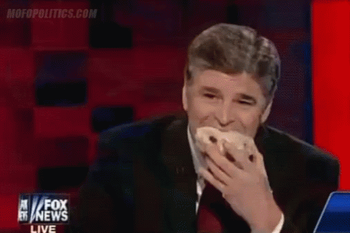 A Man Is Eating A Donut On Fox News GIF