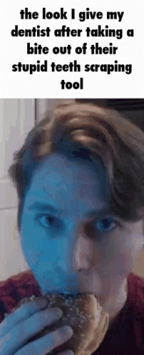 A Man Is Eating A Hamburger And Talking To A Dentist After Taking A Bite Out Of His Stupid Teeth Scraping Tool GIF