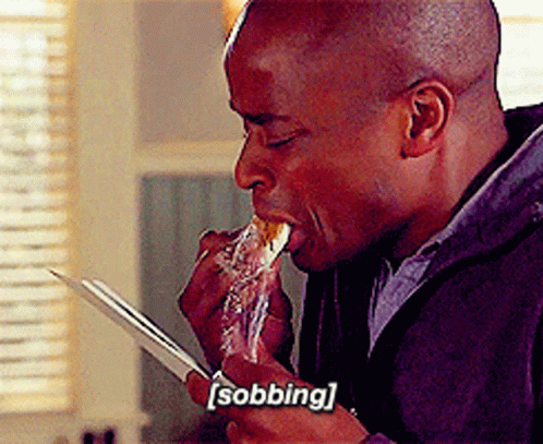 A Man Is Eating A Piece Of Food With The Word Sobbing Written On The Bottom GIF