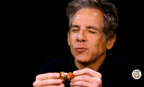 A Man Is Eating A Piece Of Food With The Words Pain Pain Written On The Background GIF