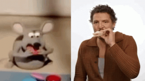 A Man Is Eating A Sandwich Next To A Stuffed Animal . GIF