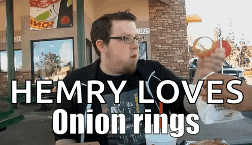 A Man Is Eating An Onion Ring With The Words Hemry Loves Onion Rings GIF