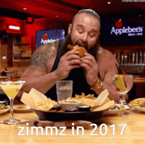 A Man Is Eating At An Applebee 'S In 2017 GIF