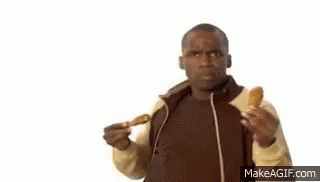 A Man Is Eating Chicken Wings And Listening To Music With Headphones . GIF