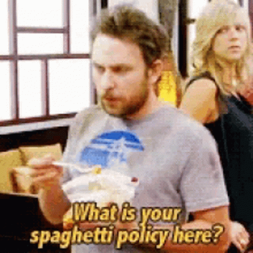 A Man Is Eating Spaghetti And Asking What Is Your Spaghetti Policy Here GIF