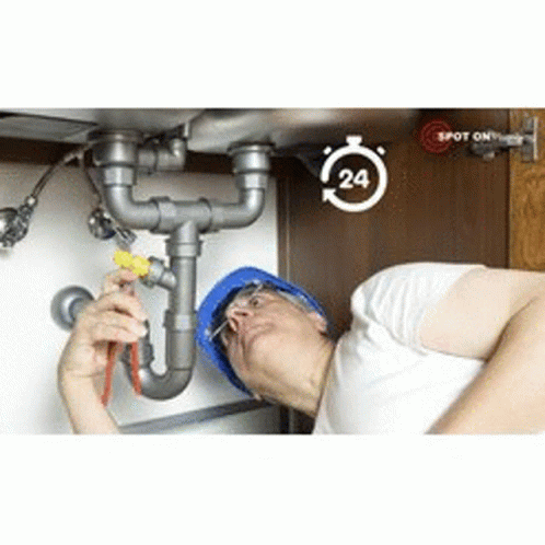 A Man Is Fixing A Sink With A Screwdriver And A Screwdriver . GIF