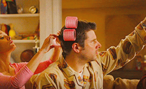 Man Getting Hair Curled By Woman GIF