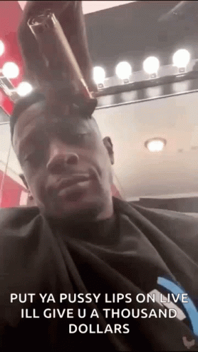 A Man Is Getting His Hair Cut At A Barber Shop And Says `` Put Ya Pussy Lips On Live '' . GIF