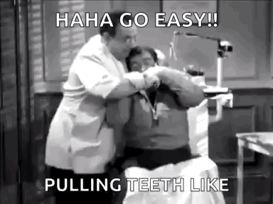A Man Is Getting His Teeth Pulled By A Dentist . GIF