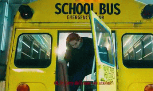 A Man Is Getting Off A Yellow School Bus With His Door Open . GIF