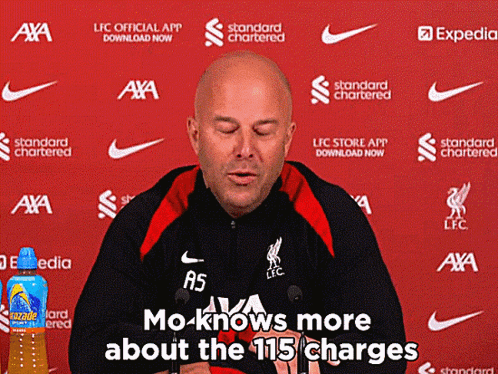A Man Is Giving A Press Conference With The Words Mo Knows More About The 115 Charges Behind Him GIF