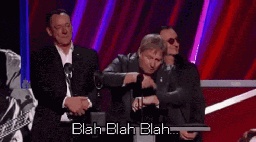 A Man Is Giving A Speech At A Podium With The Words Blah Blah Blah Behind Him GIF