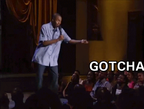 A Man Is Giving A Speech In Front Of A Crowd And The Words Gotcha Bitch Are Visible GIF