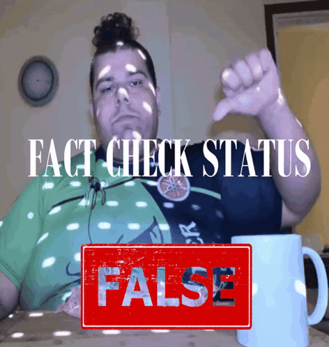 A Man Is Giving A Thumbs Down Next To A Sign That Says False GIF