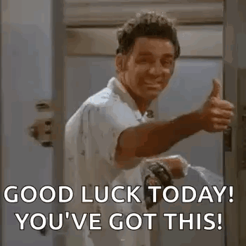 A Man Is Giving A Thumbs Up In A Doorway While Holding A Hose . GIF