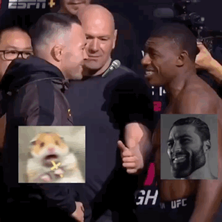 A Man Is Giving A Thumbs Up To Another Man In Front Of A Crowd . GIF