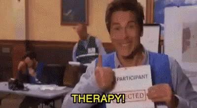 A Man Is Giving A Thumbs Up While Holding A Piece Of Paper That Says `` Participant Rejected '' . GIF