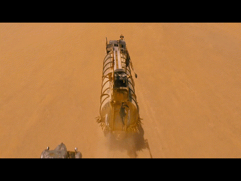 A Man Is Hanging From A Rope Next To A Vehicle GIF