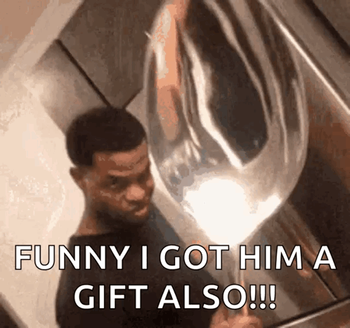 A Man Is Holding A Balloon That Says Funny I Got Him A Gift Also !!! GIF