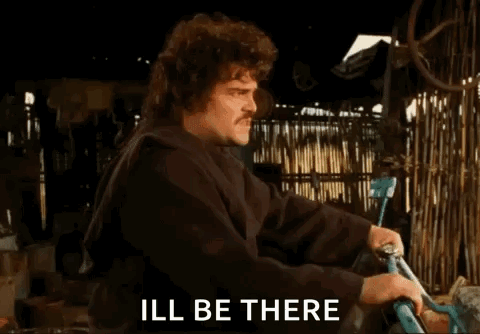 A Man Is Holding A Bicycle And Saying Ill Be There GIF