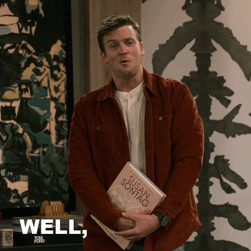 A Man Is Holding A Book By Susan Sontag And Says " Well " GIF