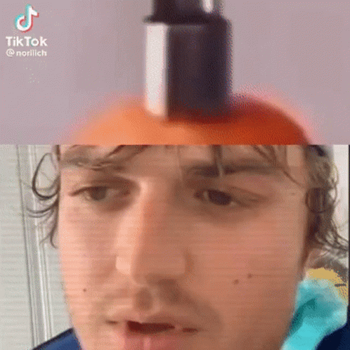 A Man Is Holding A Bottle Of Lotion On His Head . GIF