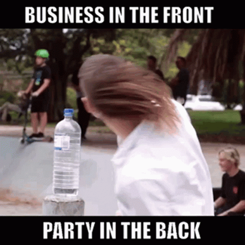 A Man Is Holding A Bottle Of Water In Front Of A Sign That Says Business In The Front GIF