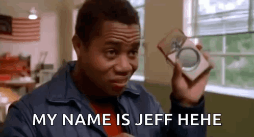 A Man Is Holding A Box In His Hand And Saying `` My Name Is Jeff He He '' . GIF