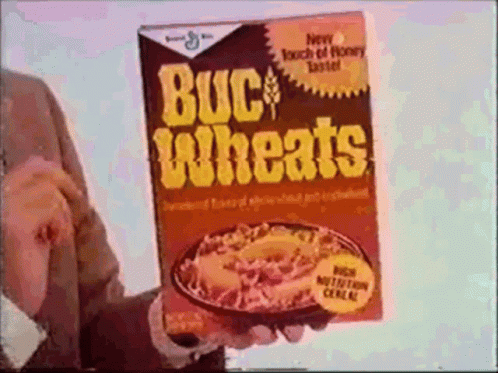 a man is holding a box of buckwheats cereal in his hand