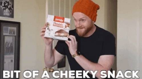 A Man Is Holding A Box Of Sara Lee Chocolate Bavarian GIF