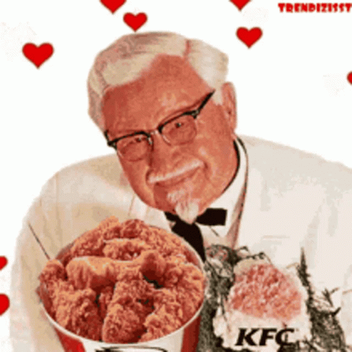 A Man Is Holding A Bucket Of Fried Chicken With Kfc Written On It GIF