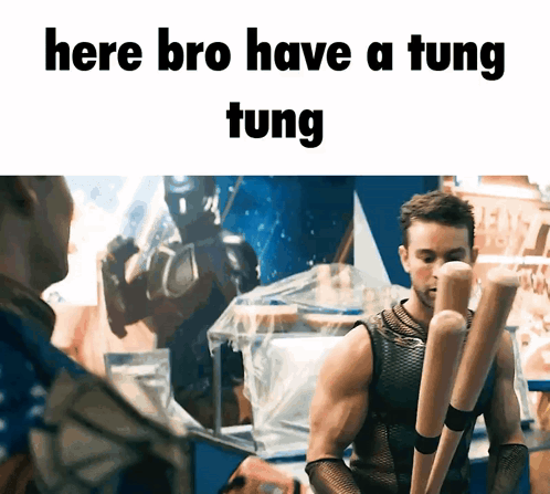 A Man Is Holding A Bunch Of Baseball Bats And Says " Here Bro Have A Tung Tung " GIF