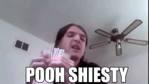 A Man Is Holding A Bunch Of Money And A Ceiling Fan In His Hands . GIF
