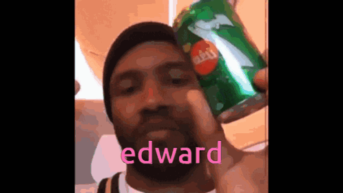 A Man Is Holding A Can Of Sprite In His Hand GIF