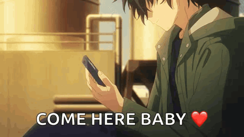 A Man Is Holding A Cell Phone And The Words Come Here Baby Are Above Him . GIF