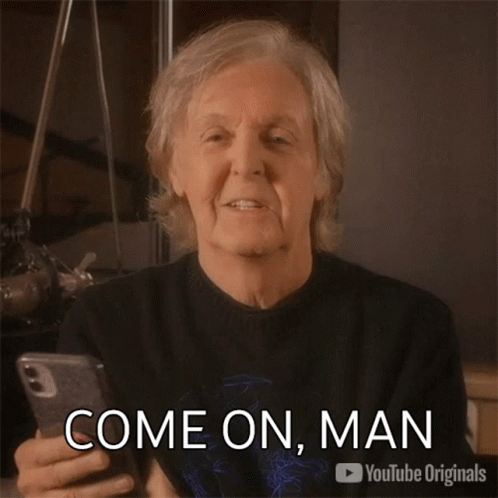 A Man Is Holding A Cell Phone With The Words Come On Man On The Bottom GIF
