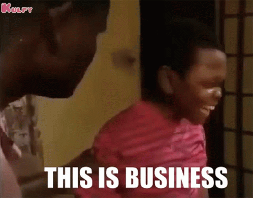 A Man Is Holding A Child Who Is Laughing And Says This Is Business GIF