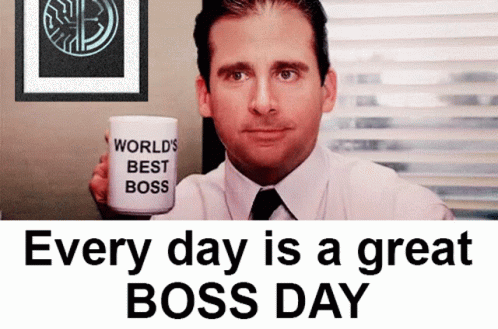 A Man Is Holding A Coffee Mug That Says World 'S Best Boss GIF