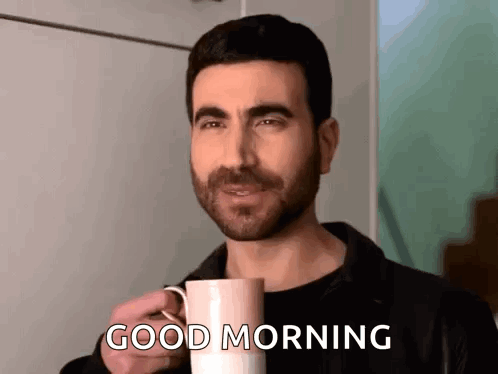 A Man Is Holding A Cup Of Coffee And Saying `` Good Morning '' . GIF