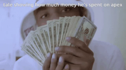 A Man Is Holding A Fan Of 100 Dollar Bills In Front Of His Face GIF